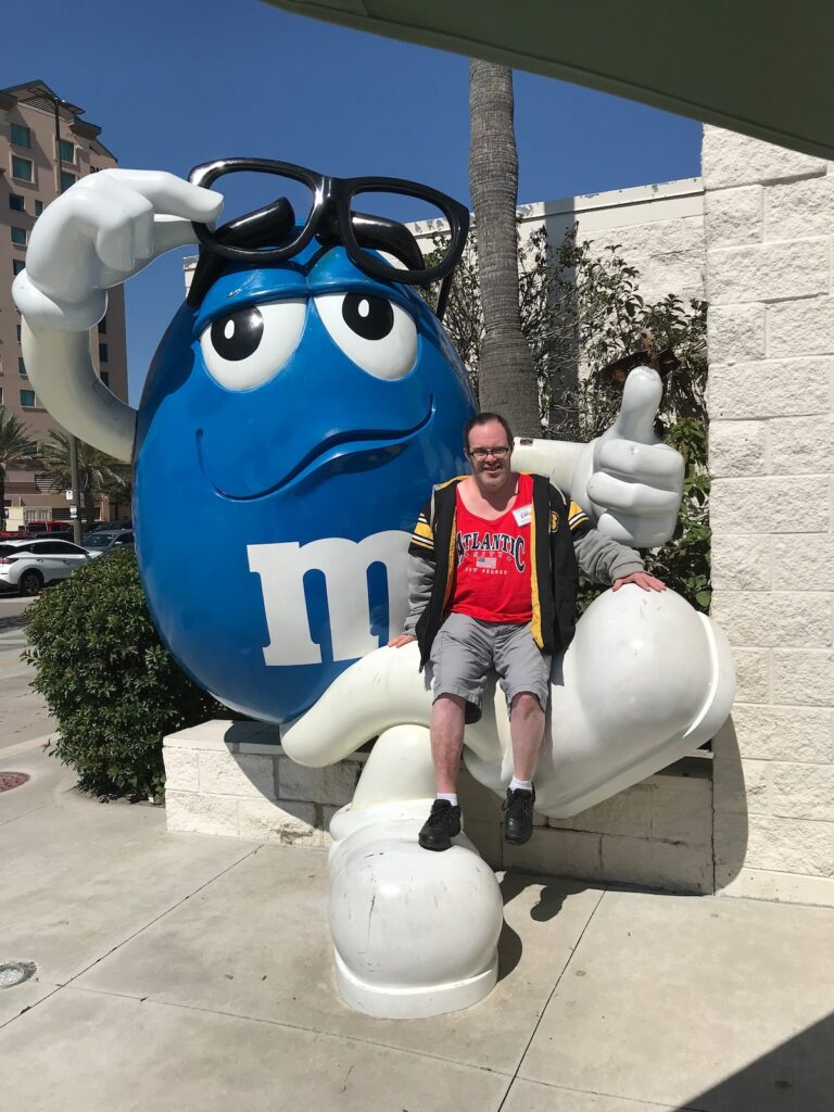 A guest with one of the M&Ms at Universal.